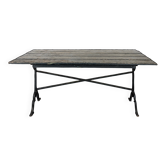 Table de jardin à piètement en fonte et plateau en bois peint vert