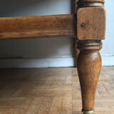 A solid wood-marked coffee table.