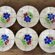 Lot de 12 assiettes motif fleurs de champagne.