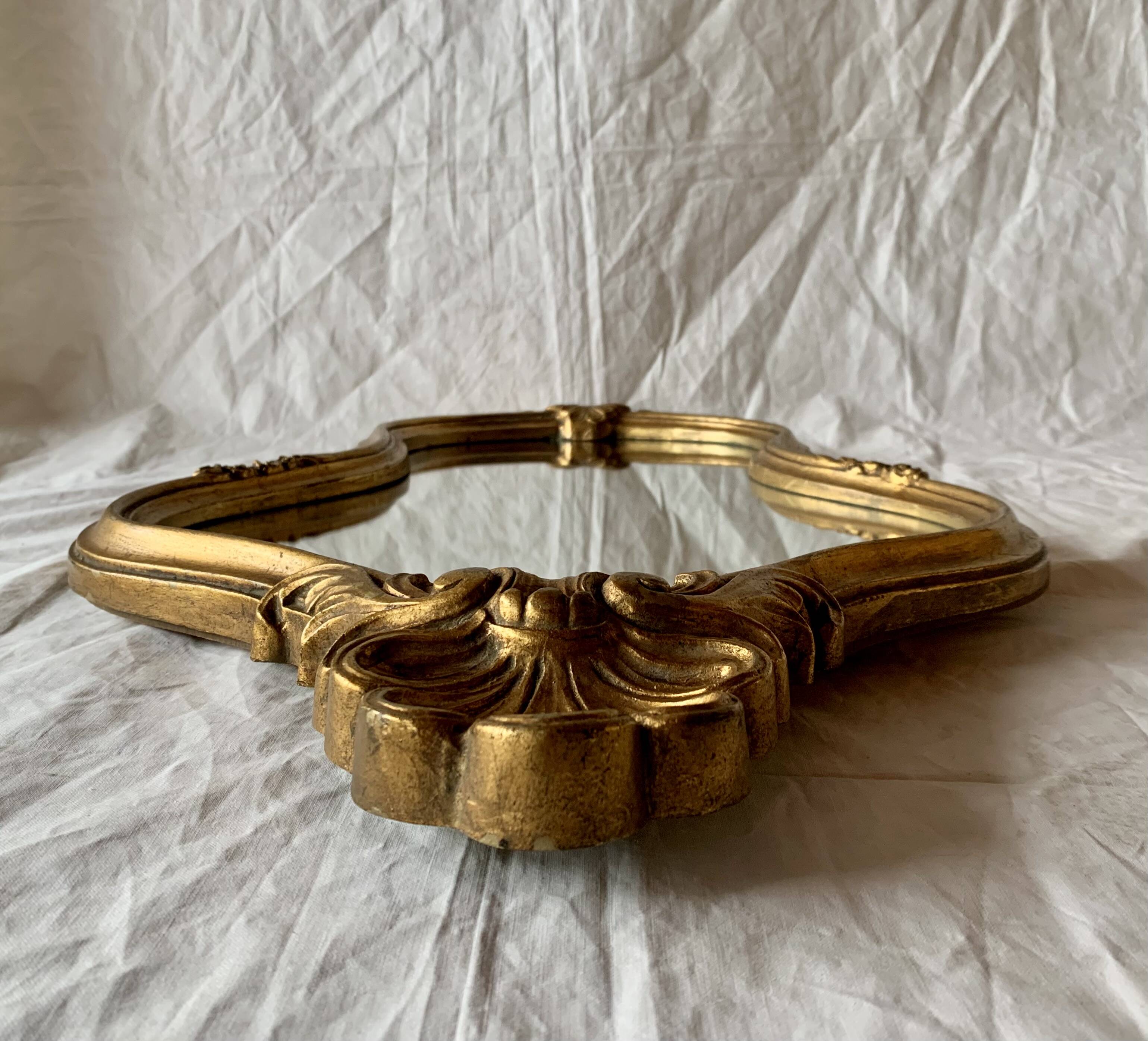 Large rococo mirror in gilded wood