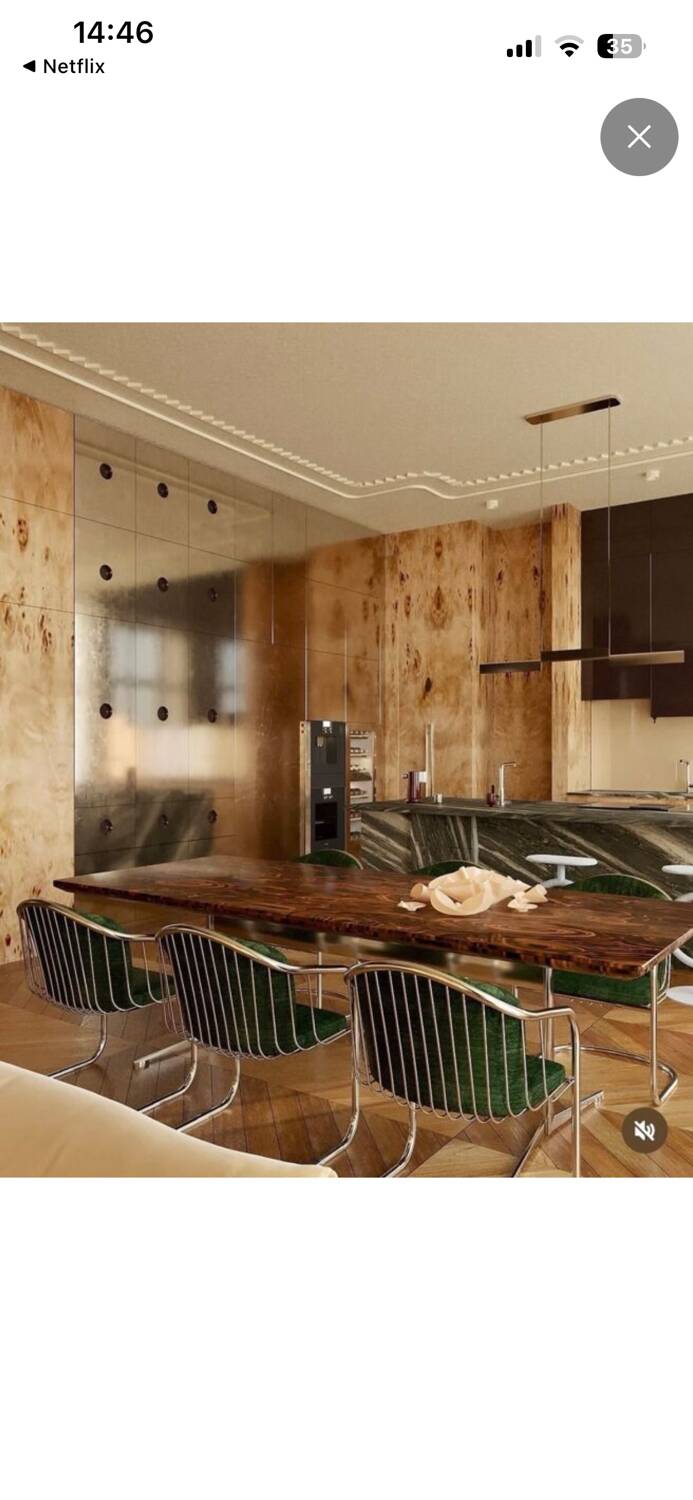 6 chrome metal chairs in the style of Gastonne Ronaldo.