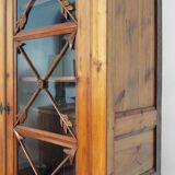 Blond wood cabinet with glass doors, 1970s.