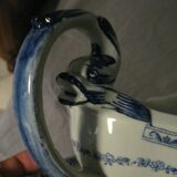 Saucière in Gien earthenware anse in the shape of a dolphin decoration garland 1900