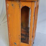 Old temple-showcase with teak offerings