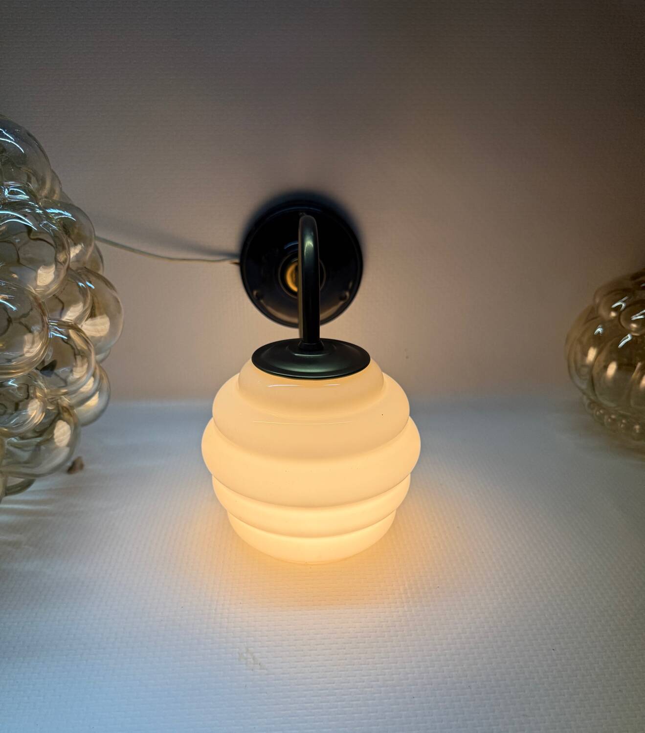 Brass and glass swan neck wall lights