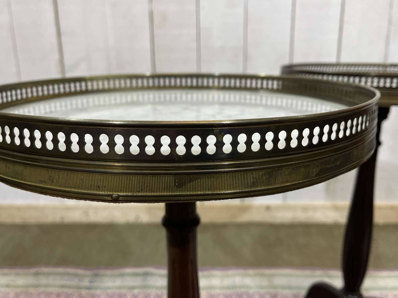 Pair of Louis XVI style mahogany side tables with marble tops