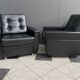 2 Black leather arm chairs 1960s on wheels