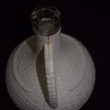 Pair of white covered demijohns