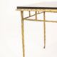 Maison Baguès. Table basse en bronze, laque noire, décor or. Circa 1970