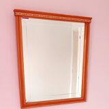 Beveled glass wall mirror in solid wood frame