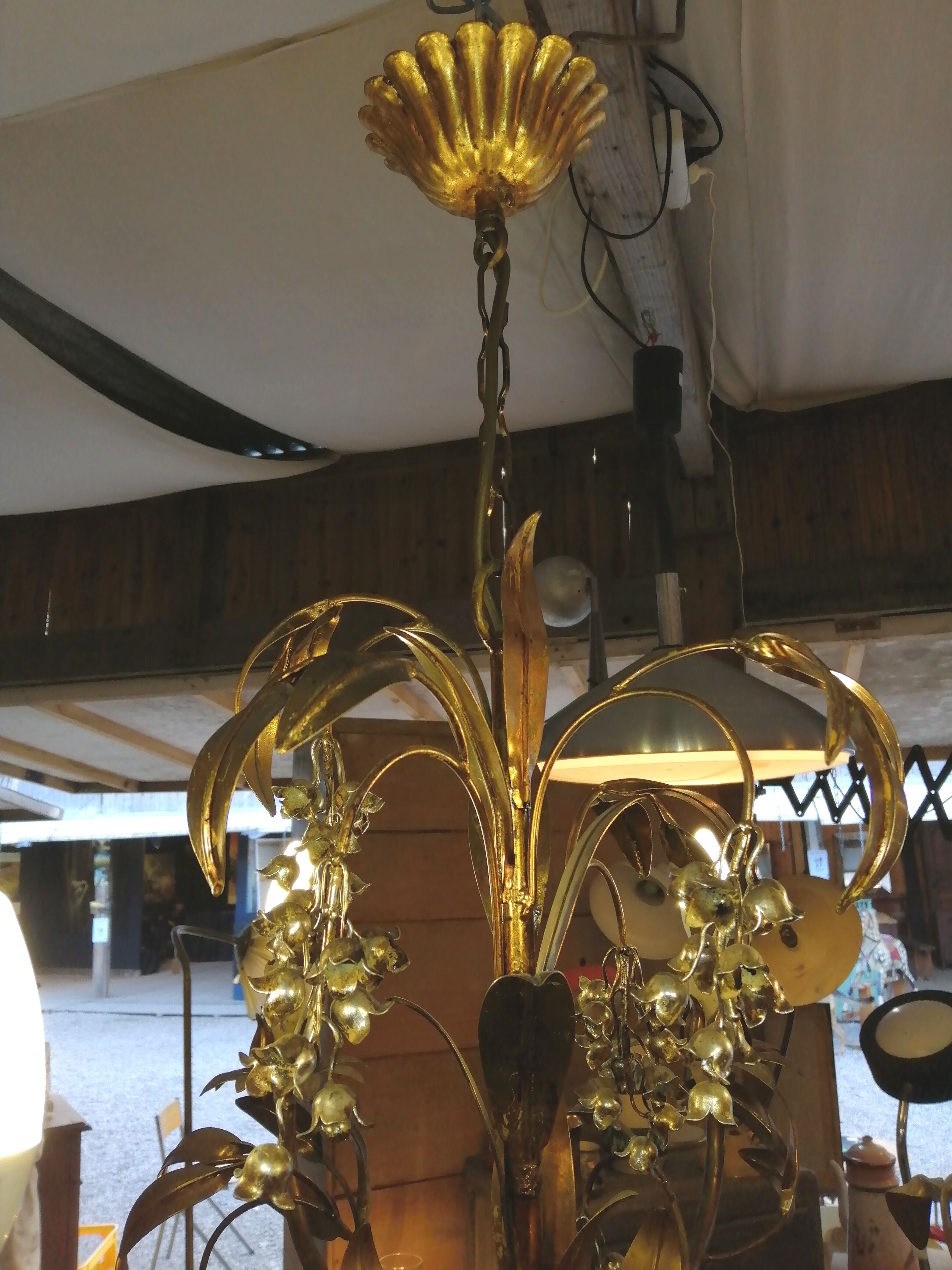 Gilded brass chandelier and silver lily of the valley bells