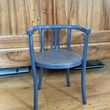 Curved wooden armchair from the late 19th/early 20th century.