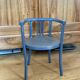 Curved wooden armchair from the late 19th/early 20th century.