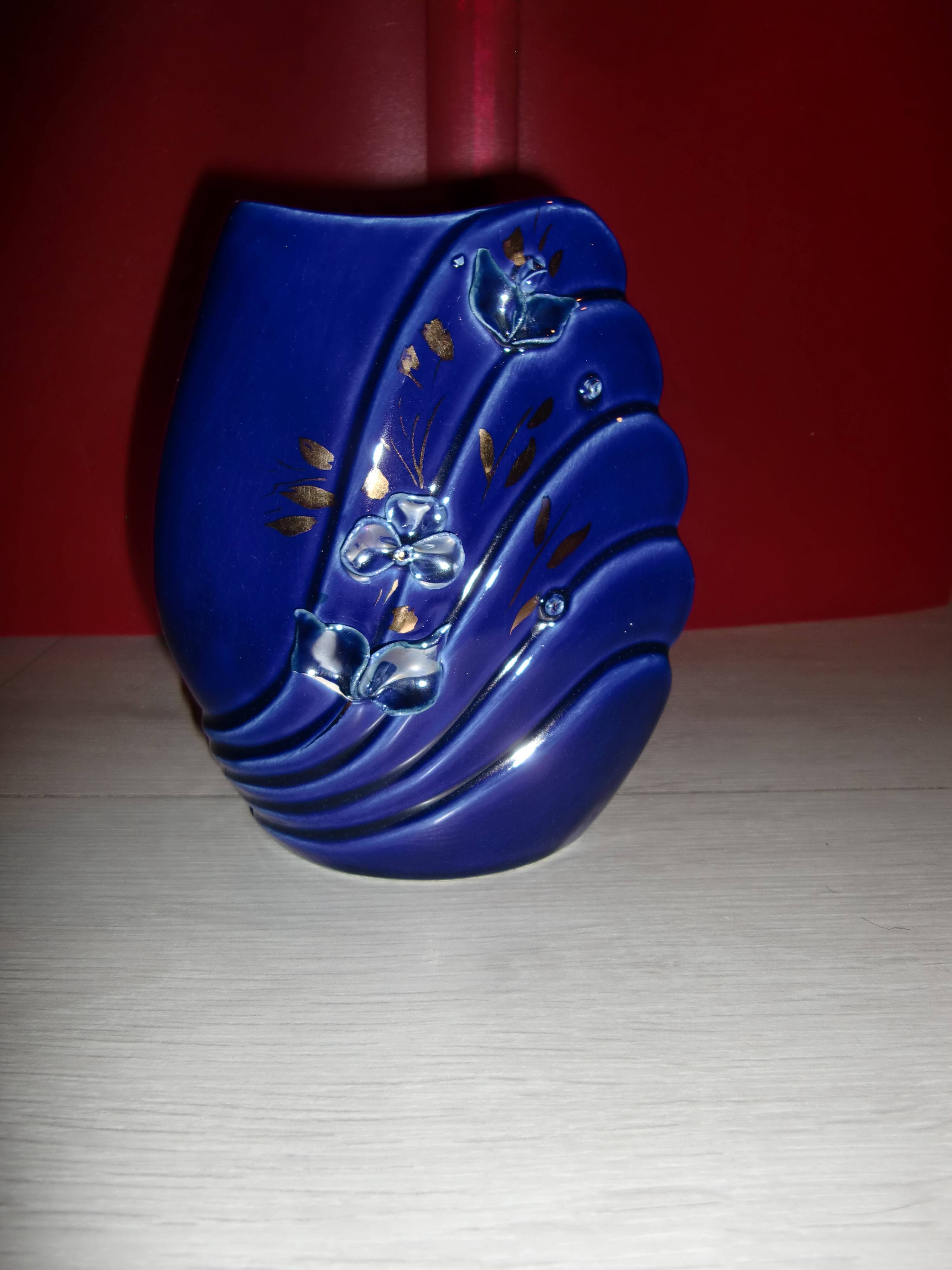 Blue lacquered vase with flowers & applied leaves