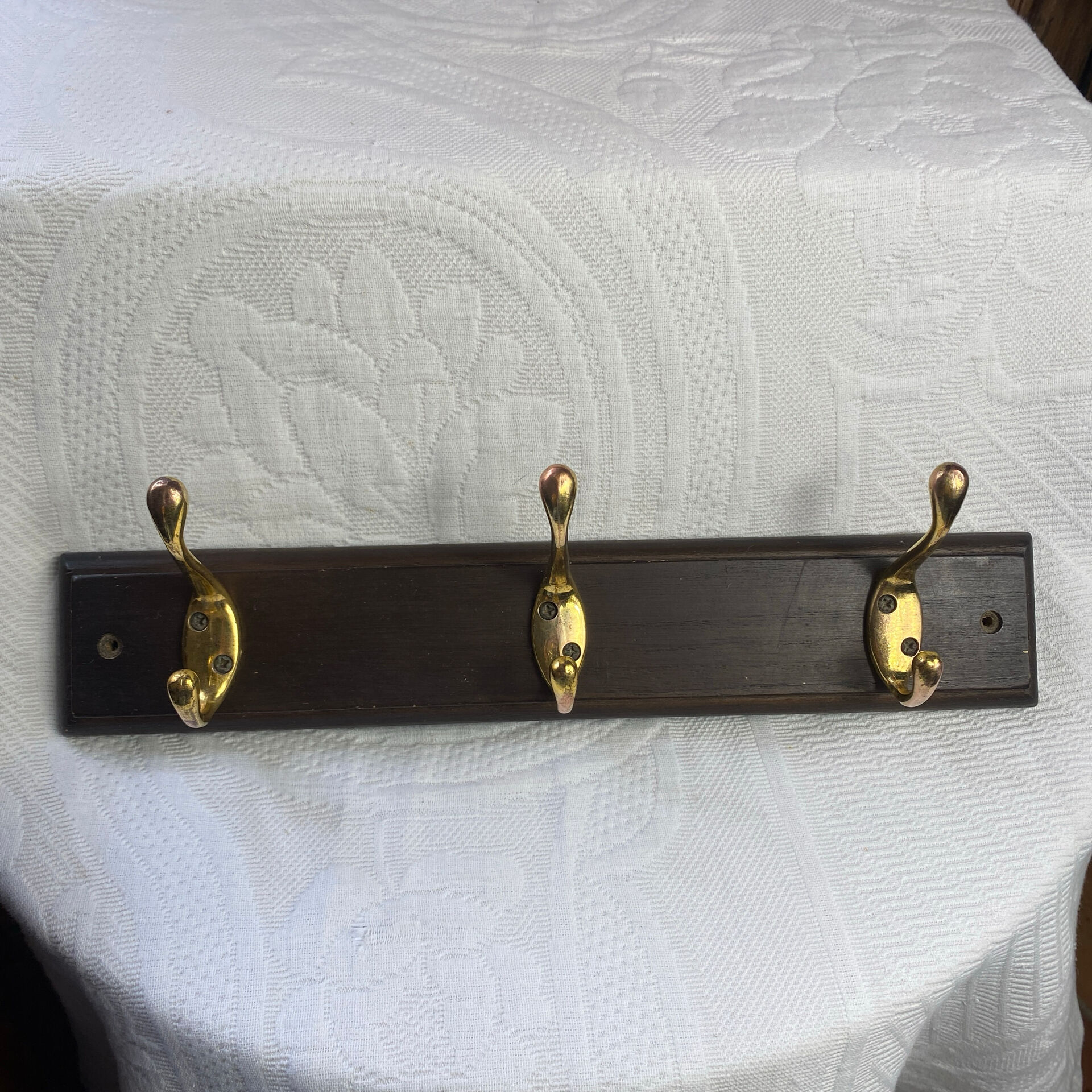 Wooden coat rack with double brass hooks