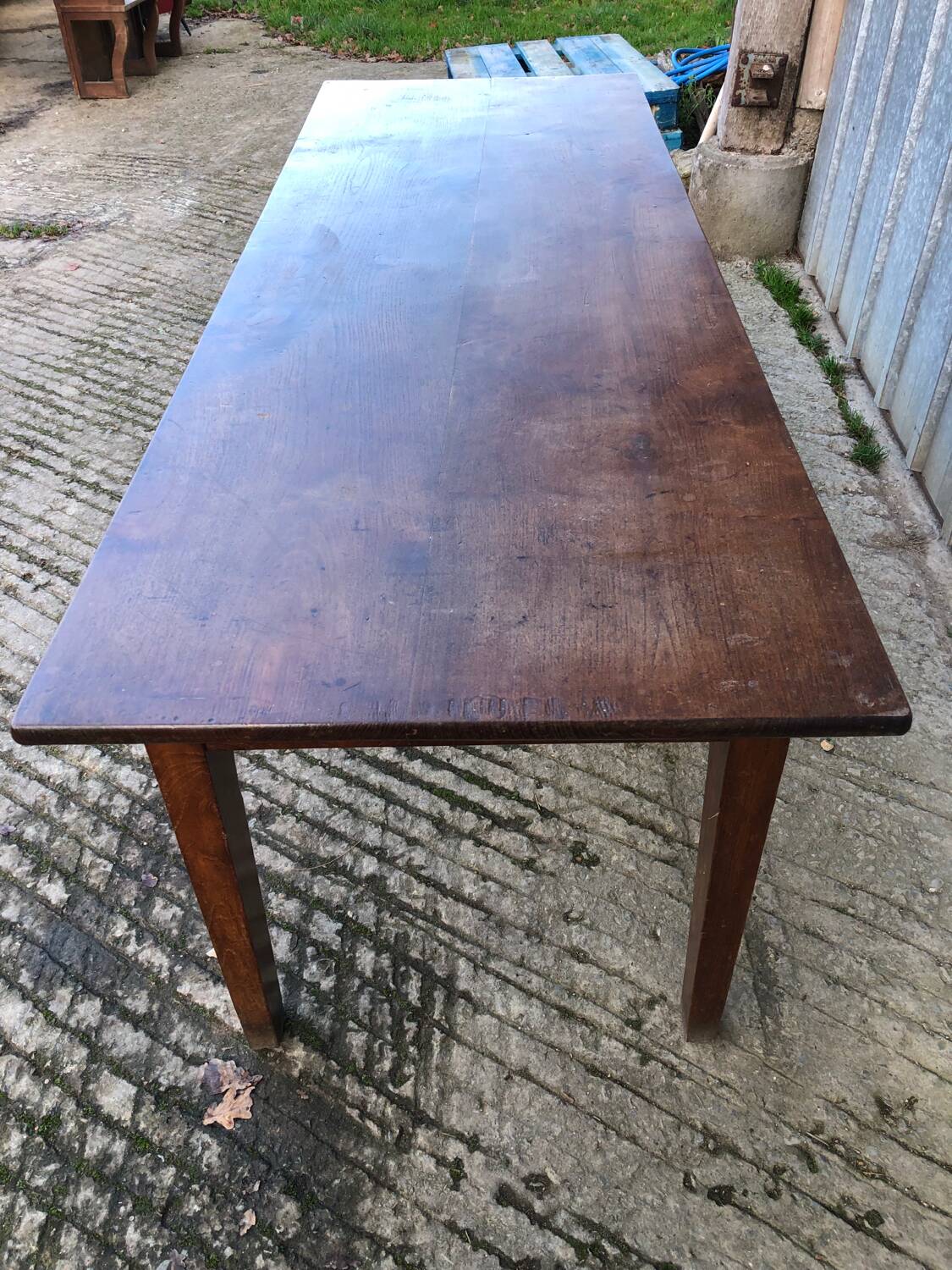 Antique chestnut farmhouse table with 3 drawers on the front.