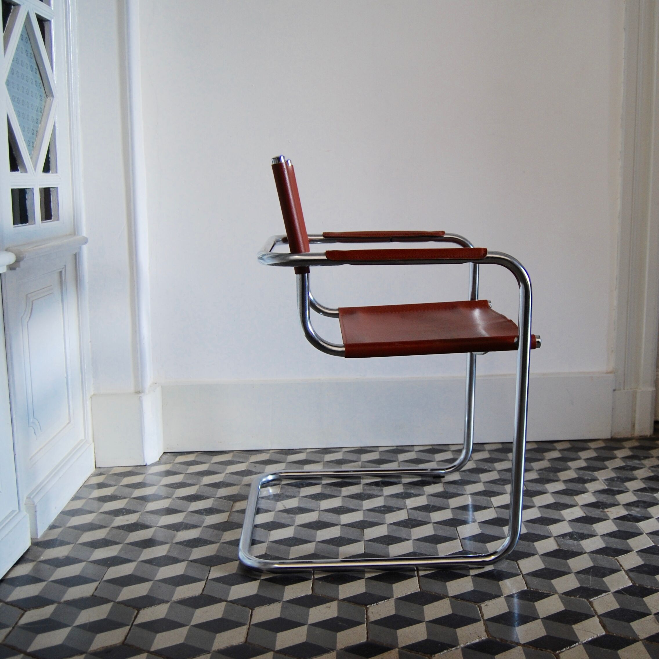 Vintage armchair in chrome and cognac leatherette