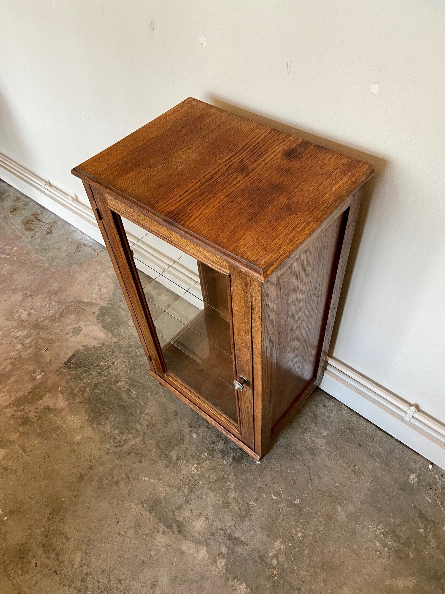 Dark wood display case and transparent glass