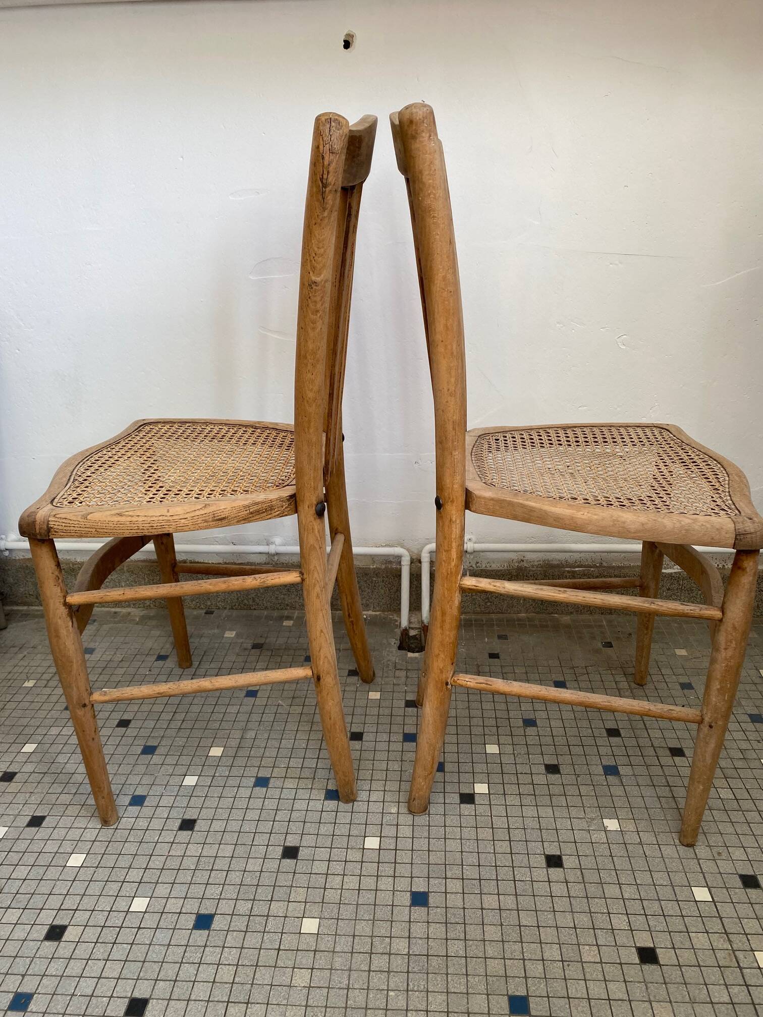 Pair of caned bistro chairs