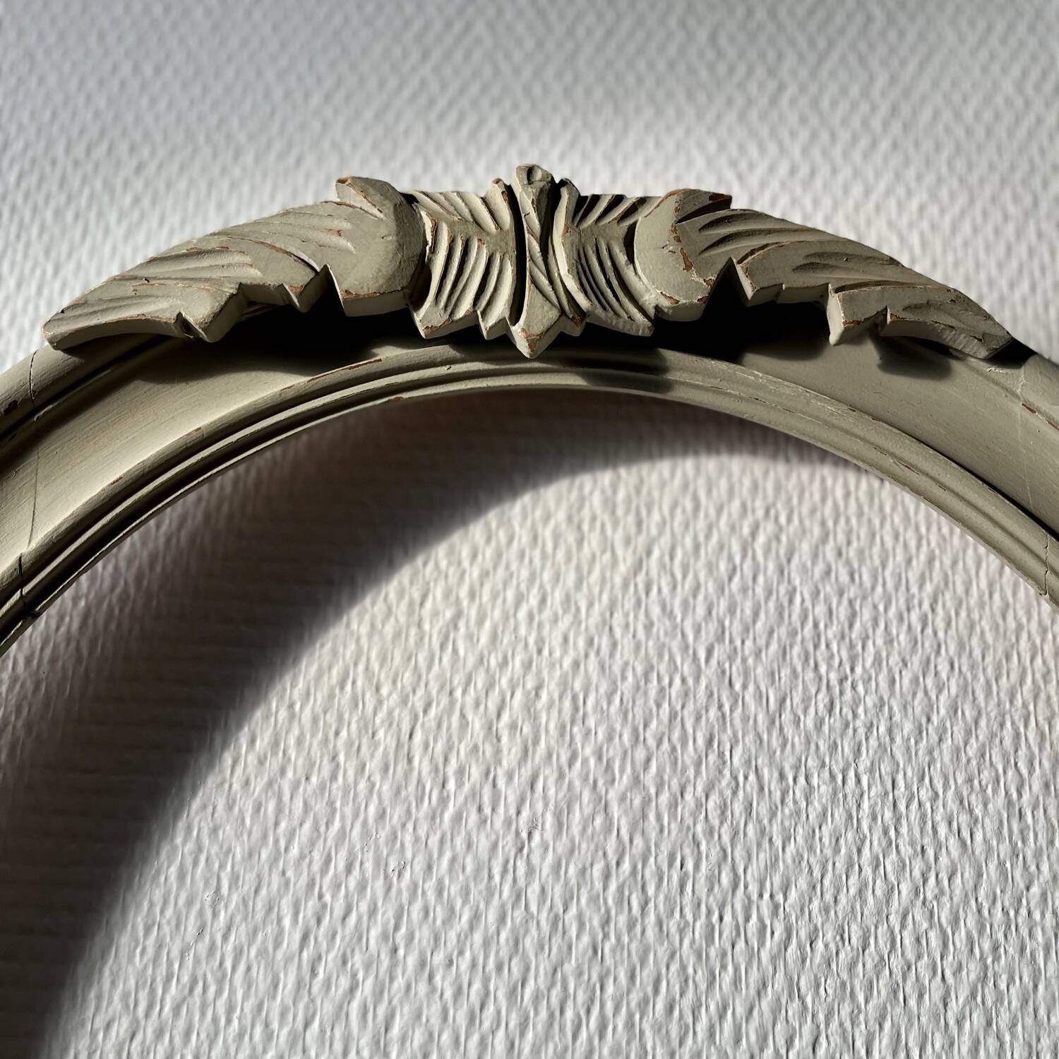 Oval frame in weathered wood