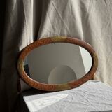 Small oval Art Deco mirror in brown and gold 33x54.