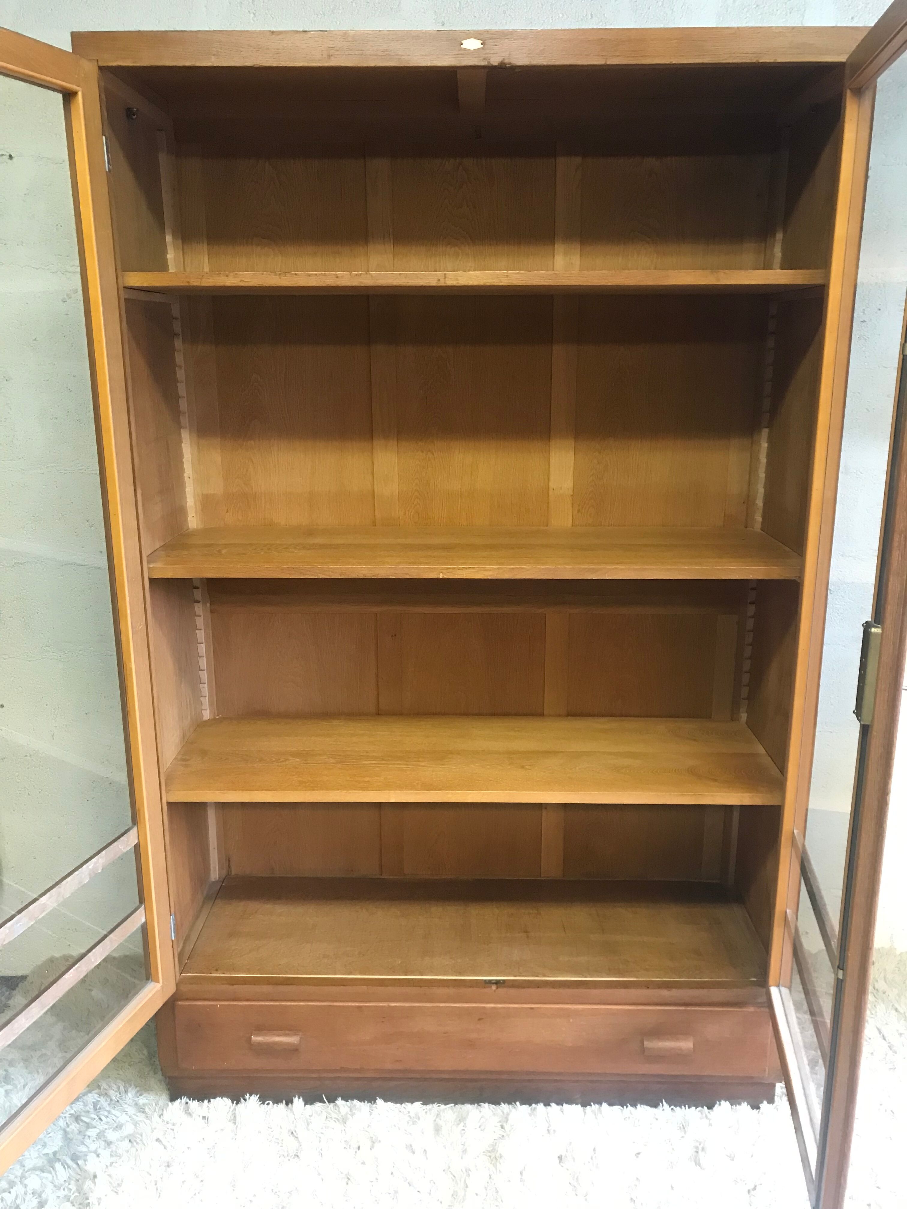 Old school glass bookcase in blond wood