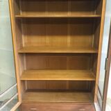 Old school glass bookcase in blond wood