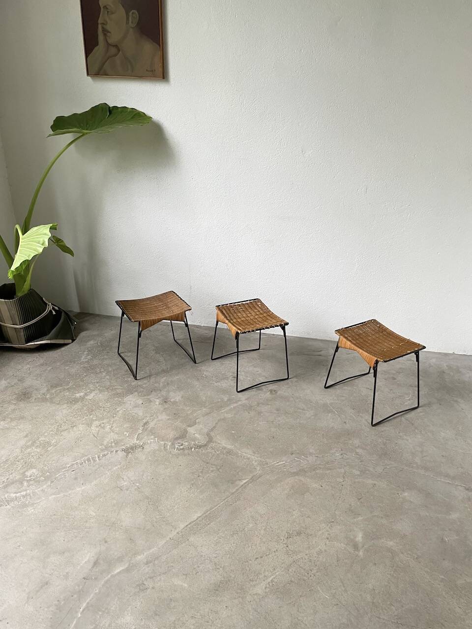 Set of three Raoul Guys wicker and metal stools