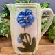 Vintage blue floral ceramic pitcher.