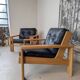 Pair of raw oak and leather armchairs by Esko Pajamies for Asko, Finland.