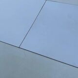 White dining table with a central pedestal, extendable, from the 1970s.