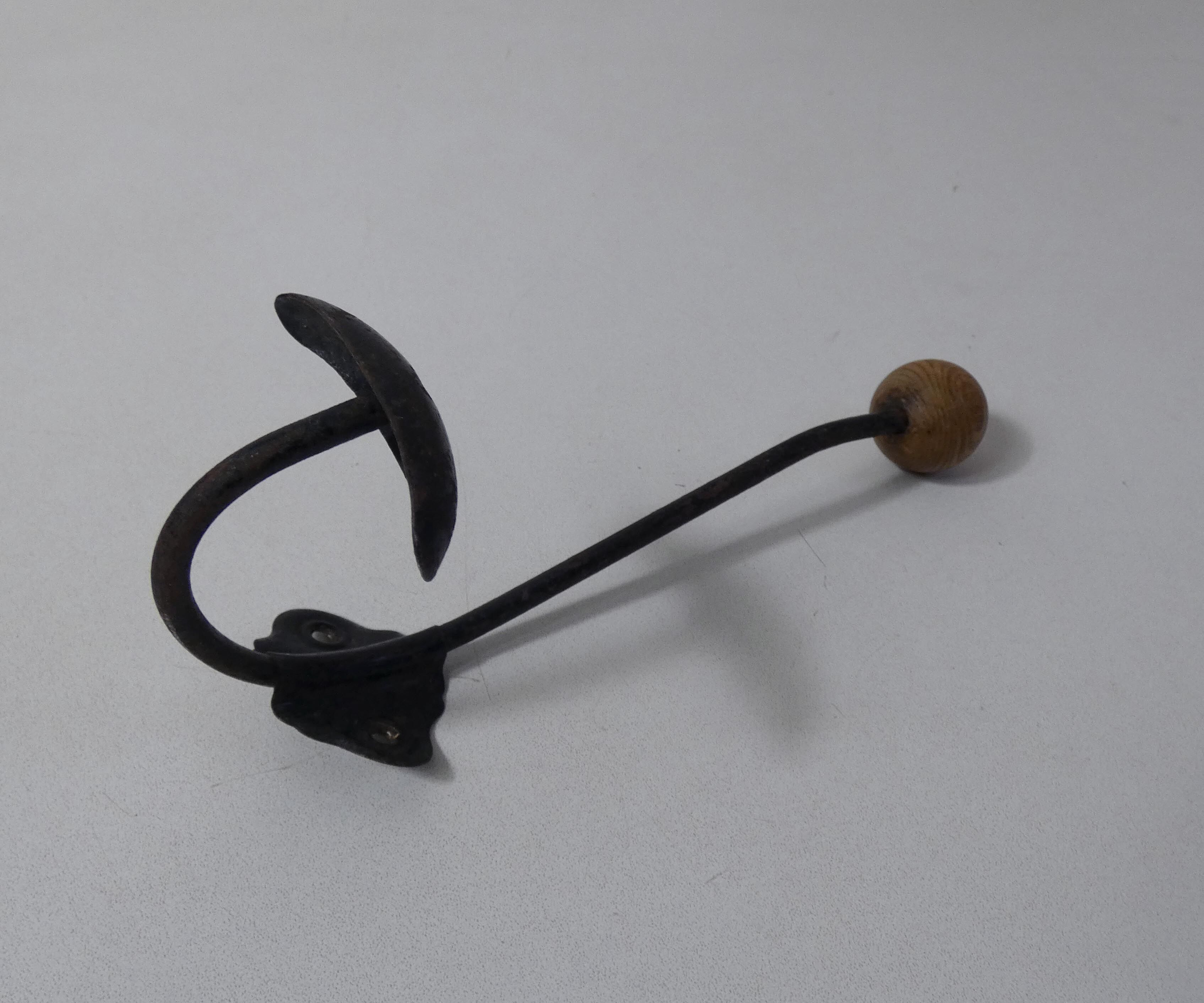 Old metal hook and wooden ball