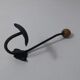 Old metal hook and wooden ball