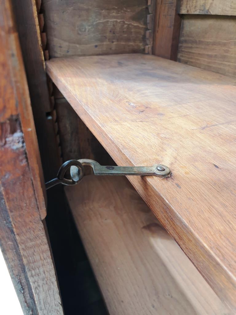 Walnut glazed bookcase with nineteenth century rose window