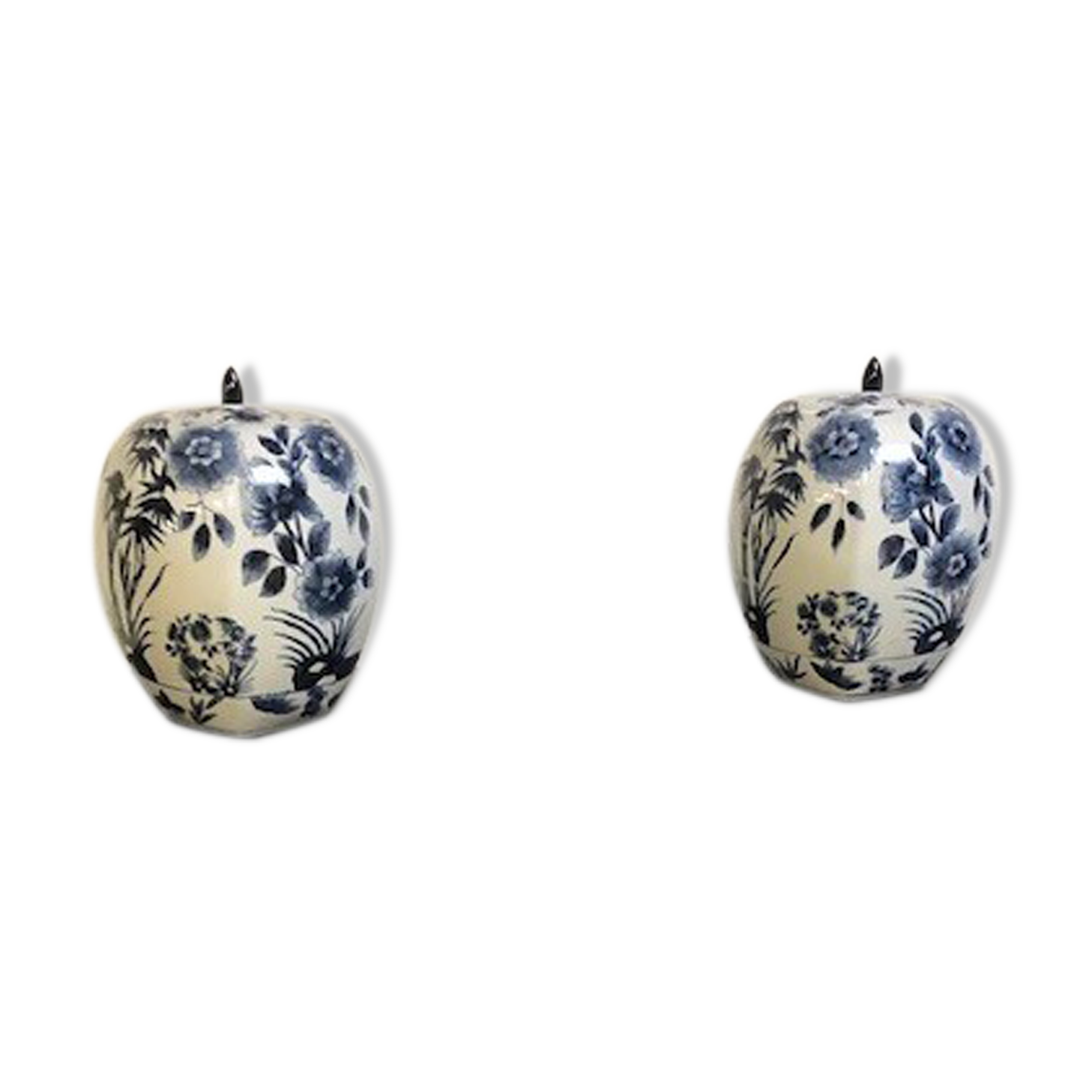 A pair of Chinese blue and white ovoid vases and flush-fitting circular covers