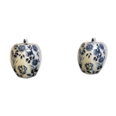 A pair of Chinese blue and white ovoid vases and flush-fitting circular covers