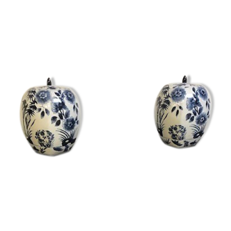 A pair of Chinese blue and white ovoid vases and flush-fitting circular covers