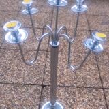 Standing candlestick in stainless steel metal with 5 movable branches, with smooth ring for 4 cm candles.