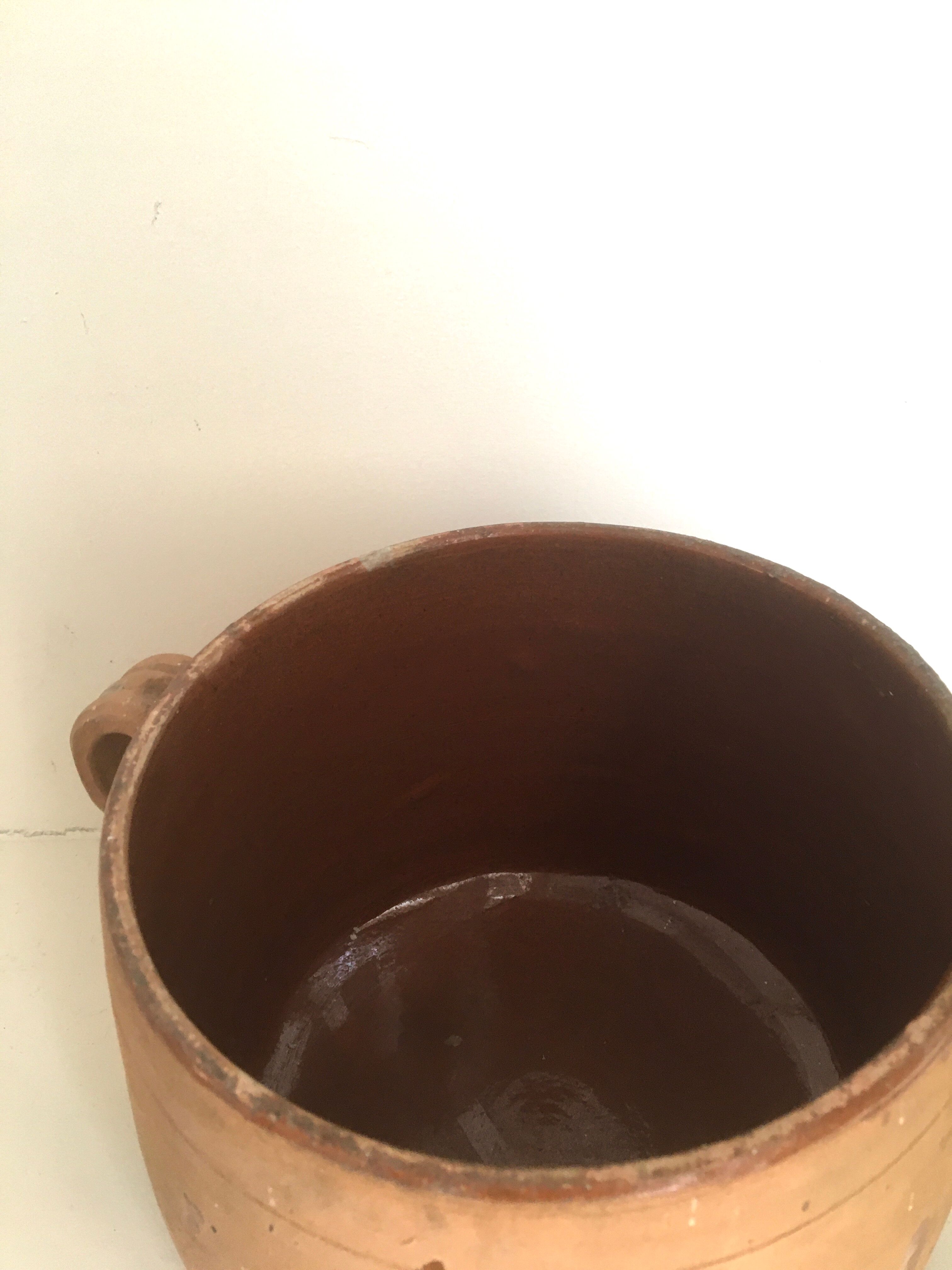 Terracotta marmite and enamelled interior