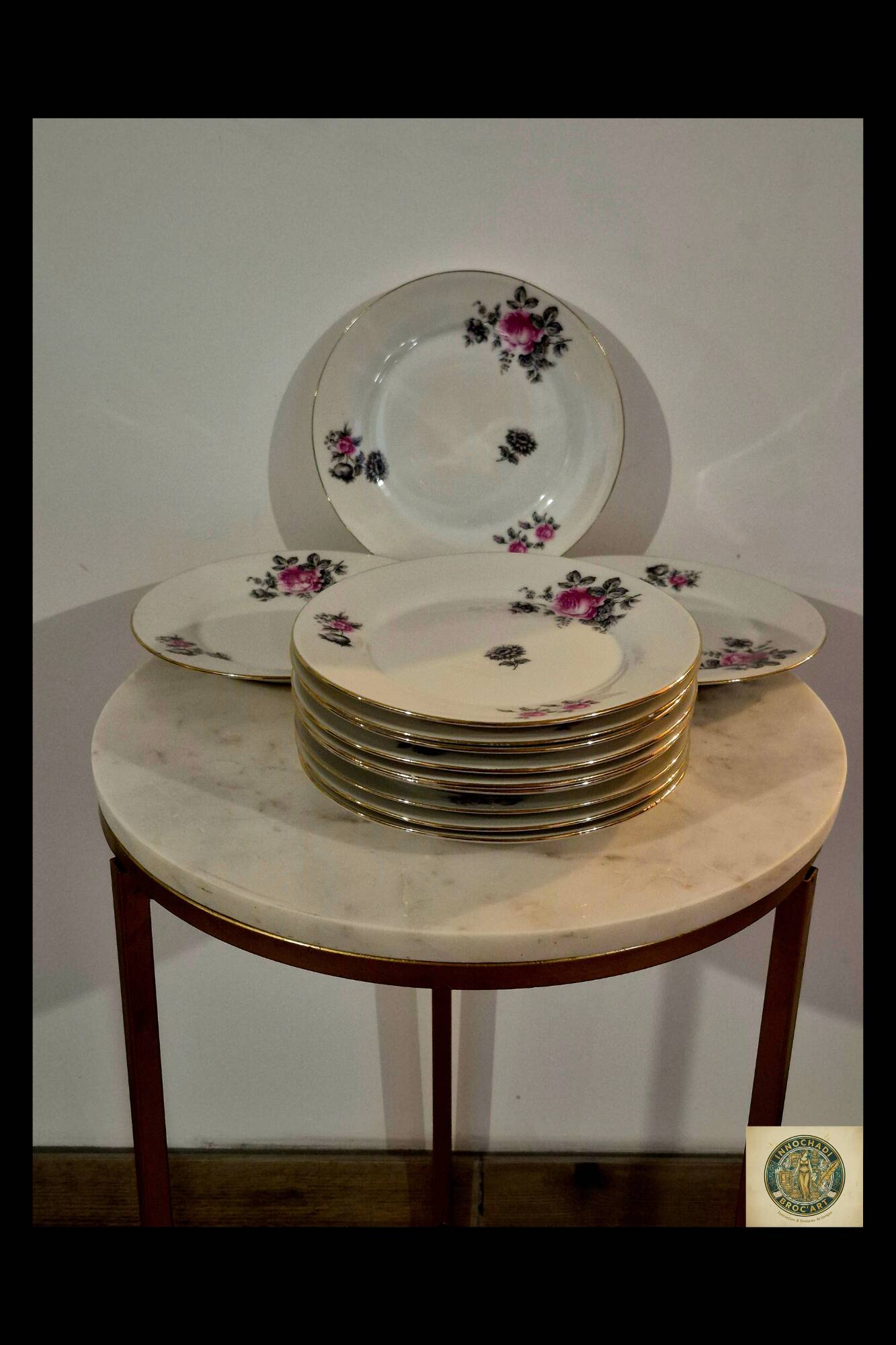 Service of 12 porcelain plates in romantic style.