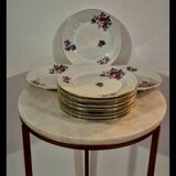 Service of 12 porcelain plates in romantic style.