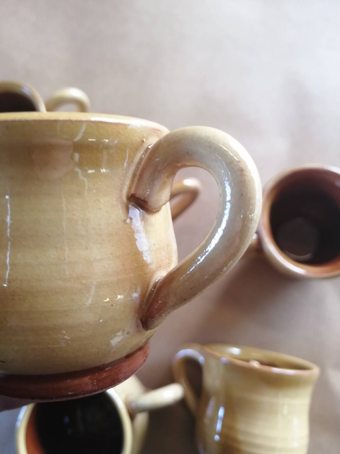 Set of 7 vintage stoneware yellow coffee cups