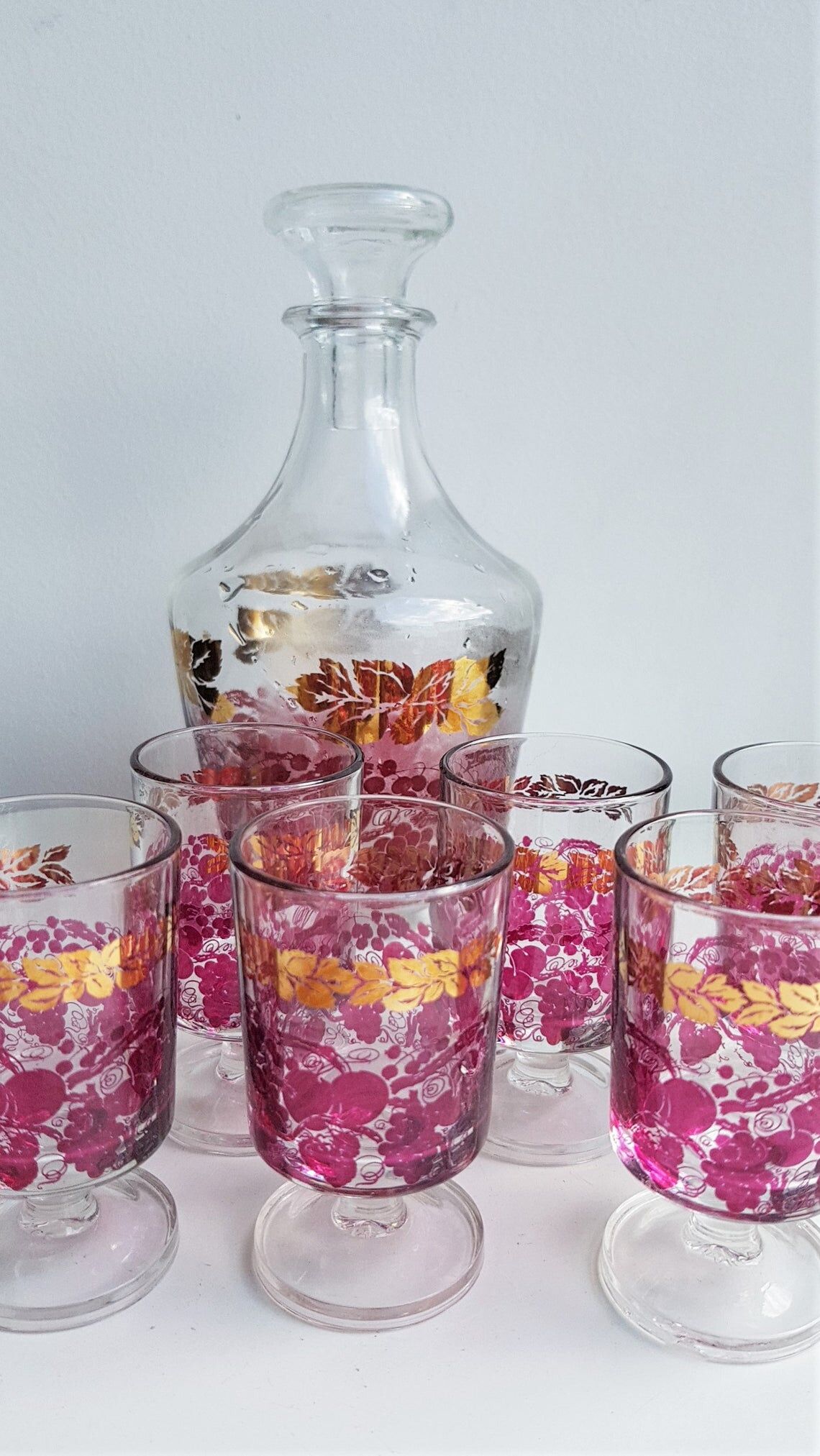 Pink and gilded glass liquor service
