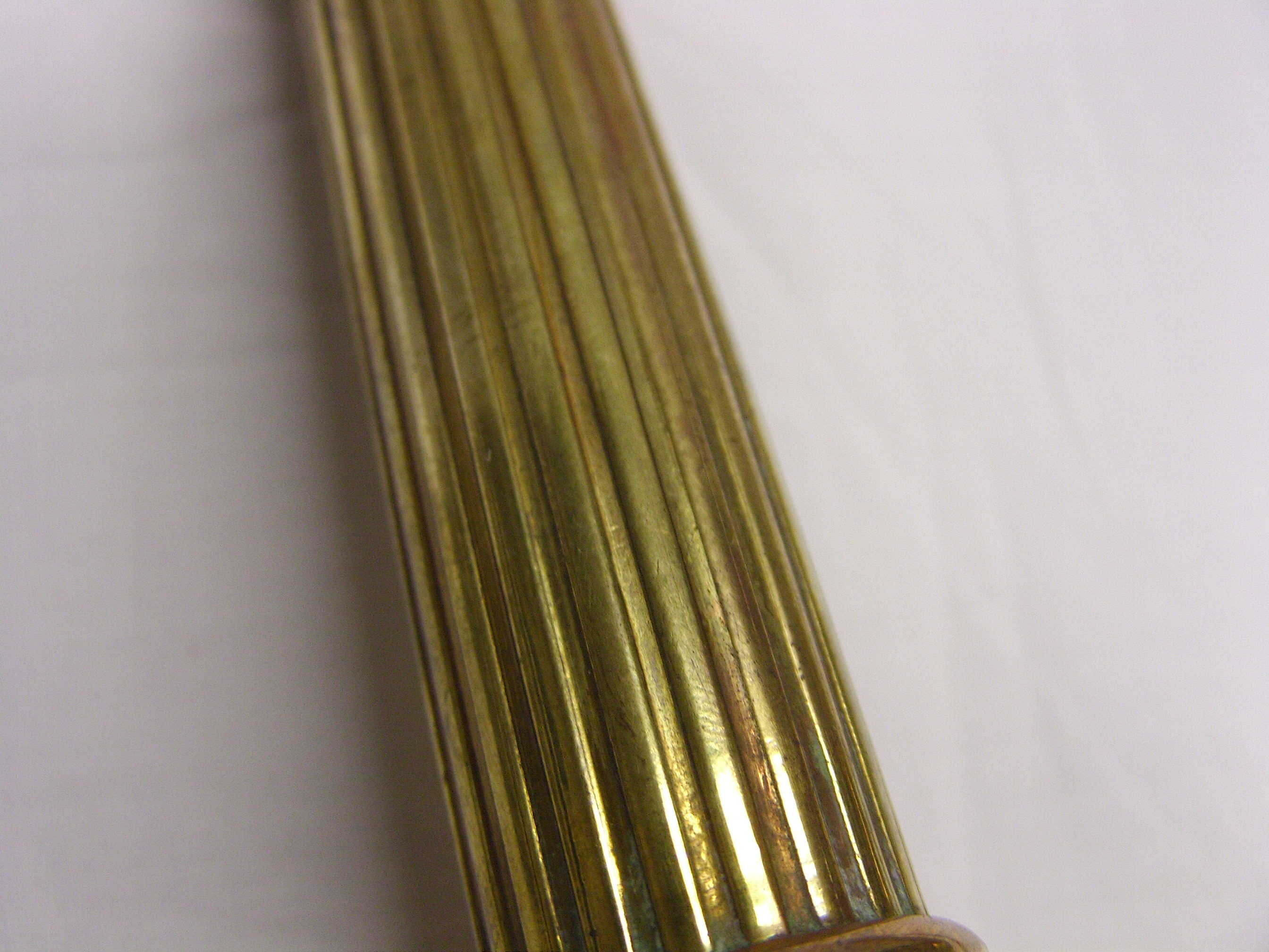 Pair of fluted brass candlesticks Louis XVI style