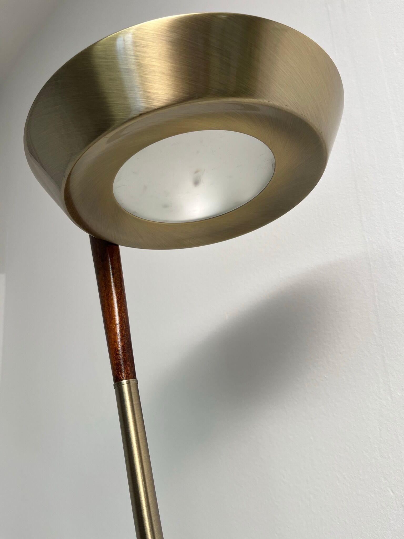Golden metal floor lamp with reading light