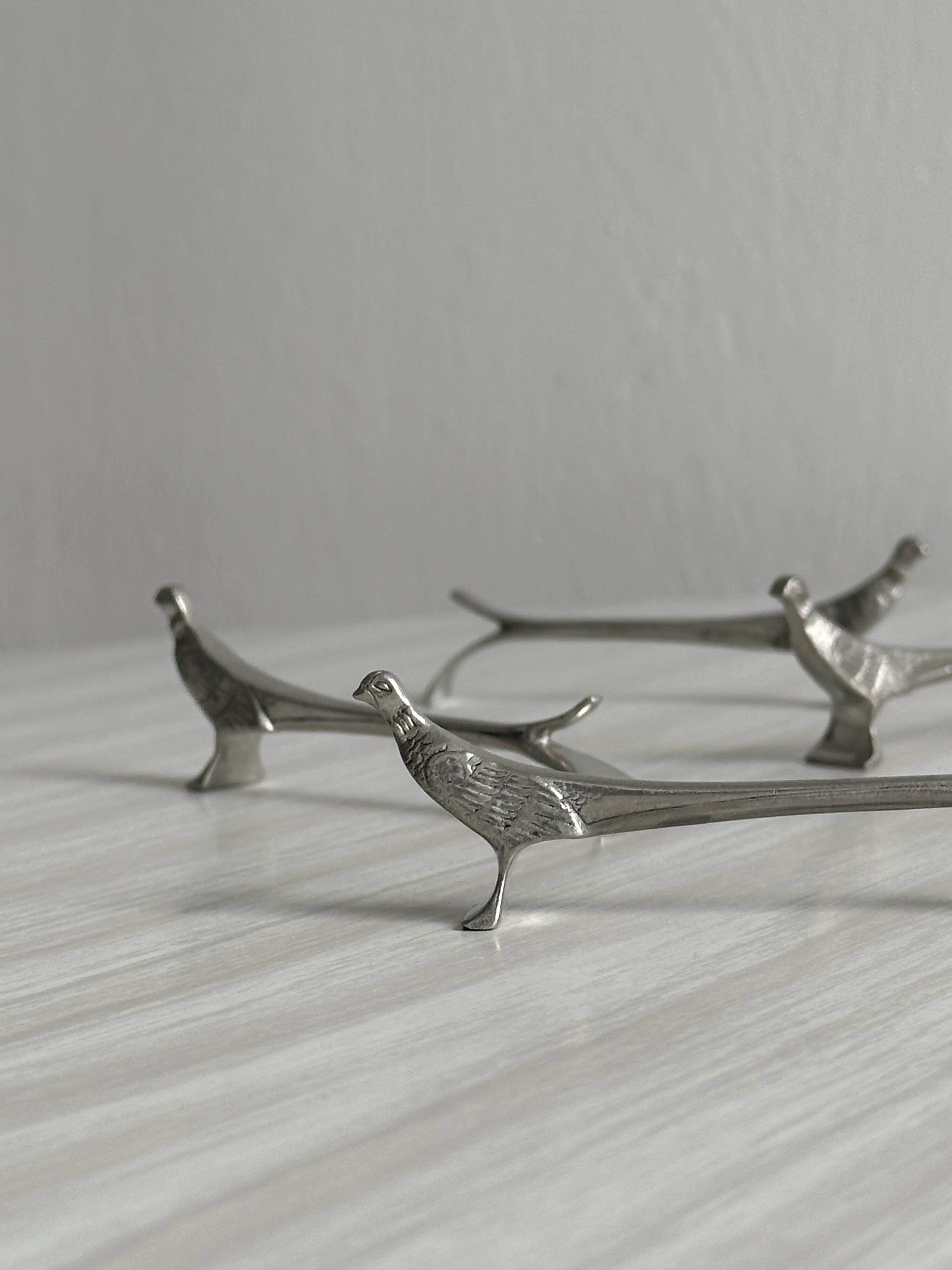 6 silver metal knife holders, pheasant shape