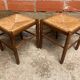 Pair of vintage wooden stools with woven straw seats