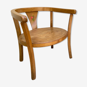 Old armchair for children in wood
