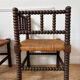 Pair of rush-seated chairs by the fireside "bobbin"