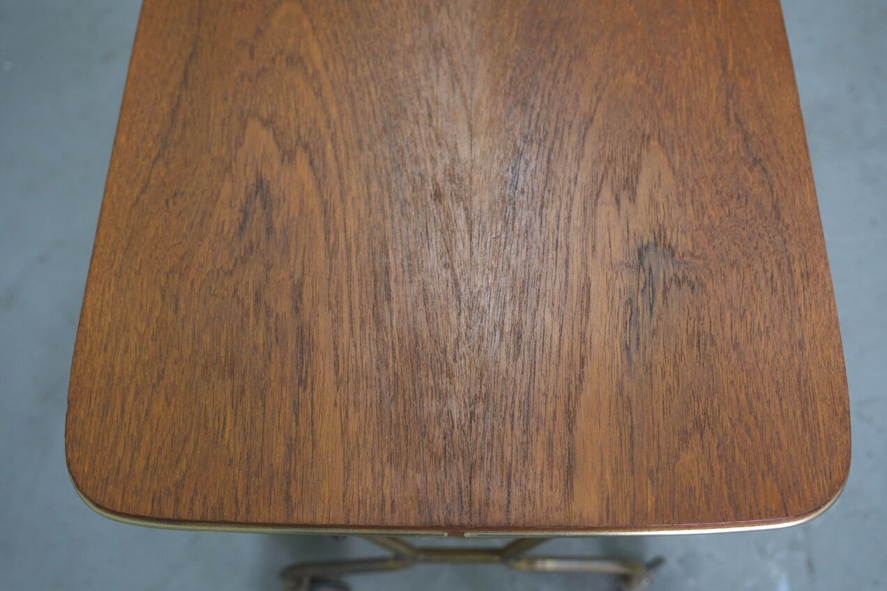 Mid-century teak and brass mobile side table with magazine holder, 1960s